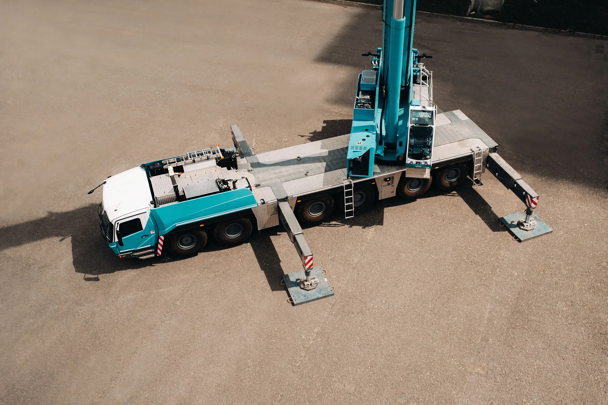 view from the height of the Car heavy crane that stands open in the Parking lot and ready to work